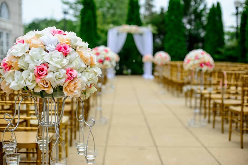 A wedding aisle lined with flowers