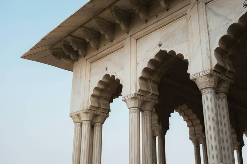 White marble arches against the sky